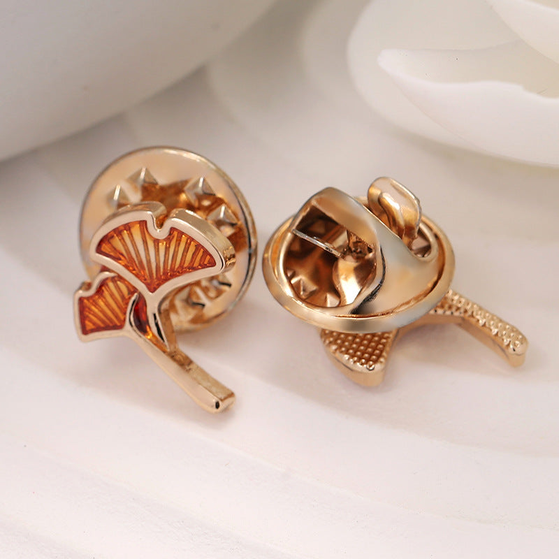 Rose-gold ginkgo leaf shirt pin brooch back view, hinge pin and fastening clasp.