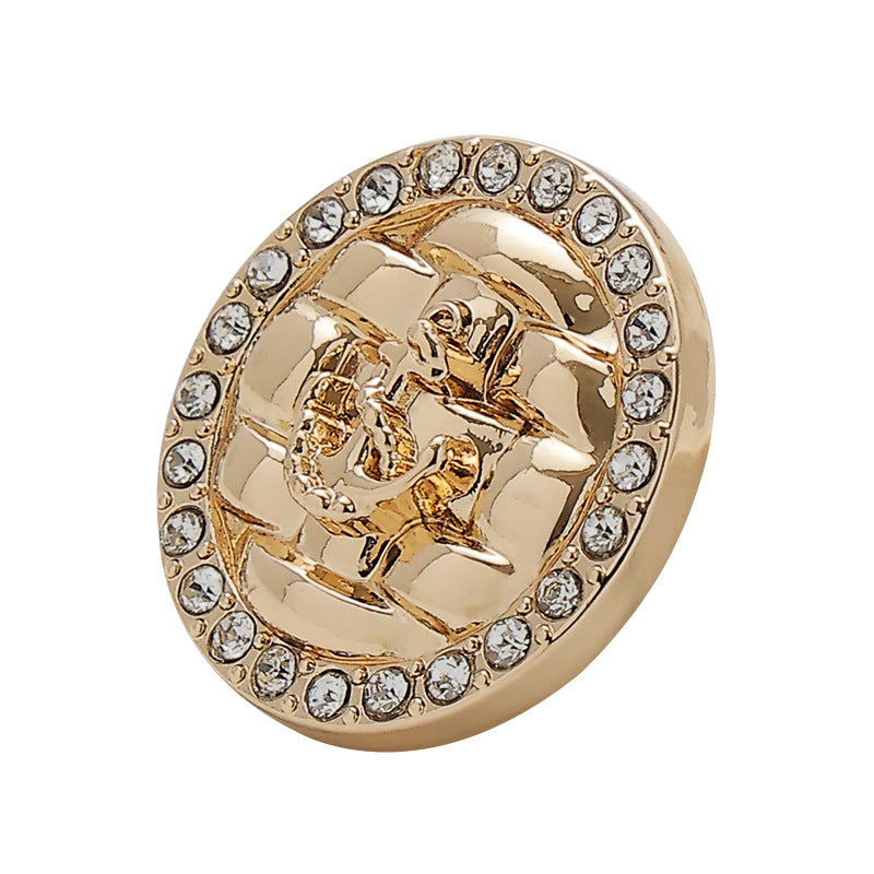 Gold metal button with rhinestone edge and diamond anchor motif