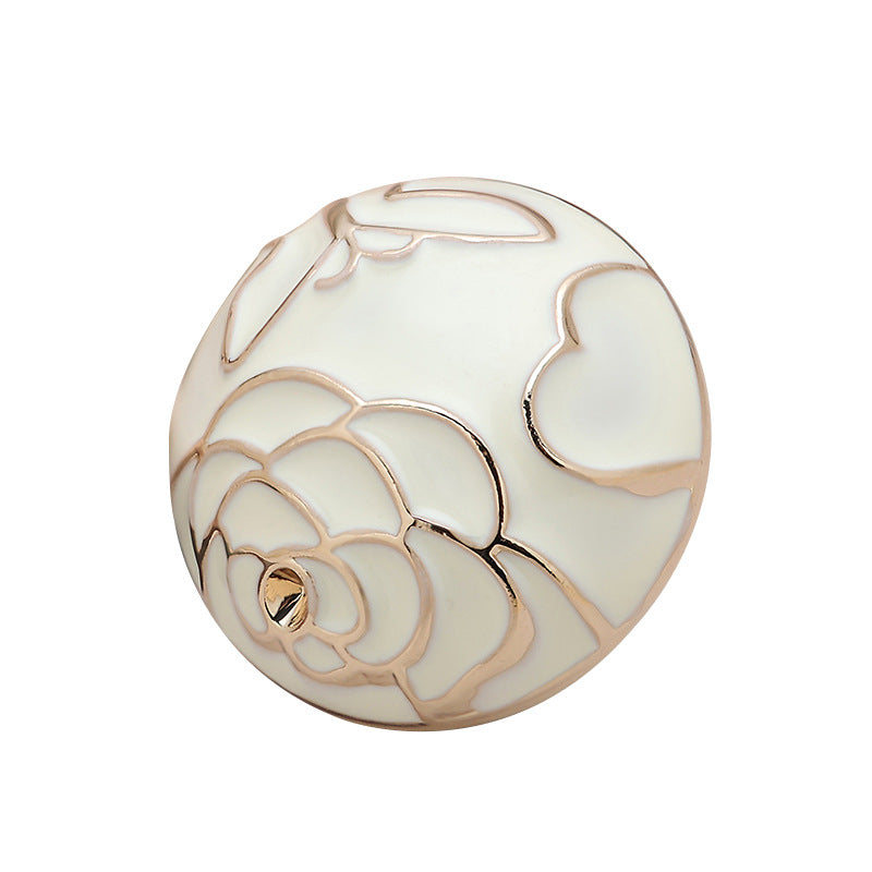White camellia floral textured metal button, mushroom shape, front view