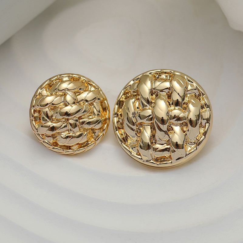 Gold round metal button pair with braided raised pattern, polished shine