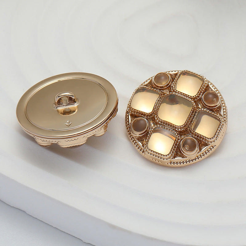 Rose gold metal shank coat buttons, front and back view with fastening loop