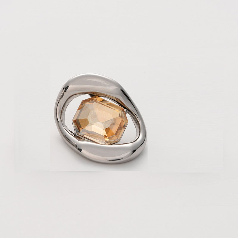 Silver-tone metal button with light orange faceted crystal, square geometric setting