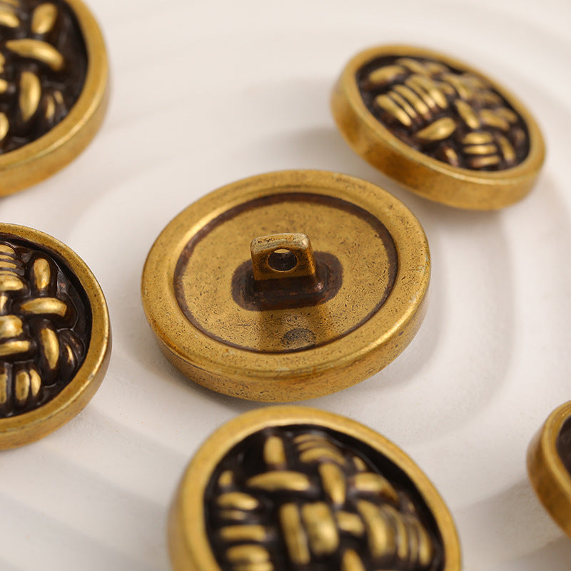 Metal button backs with loop shank, gold rim and black disk reverse