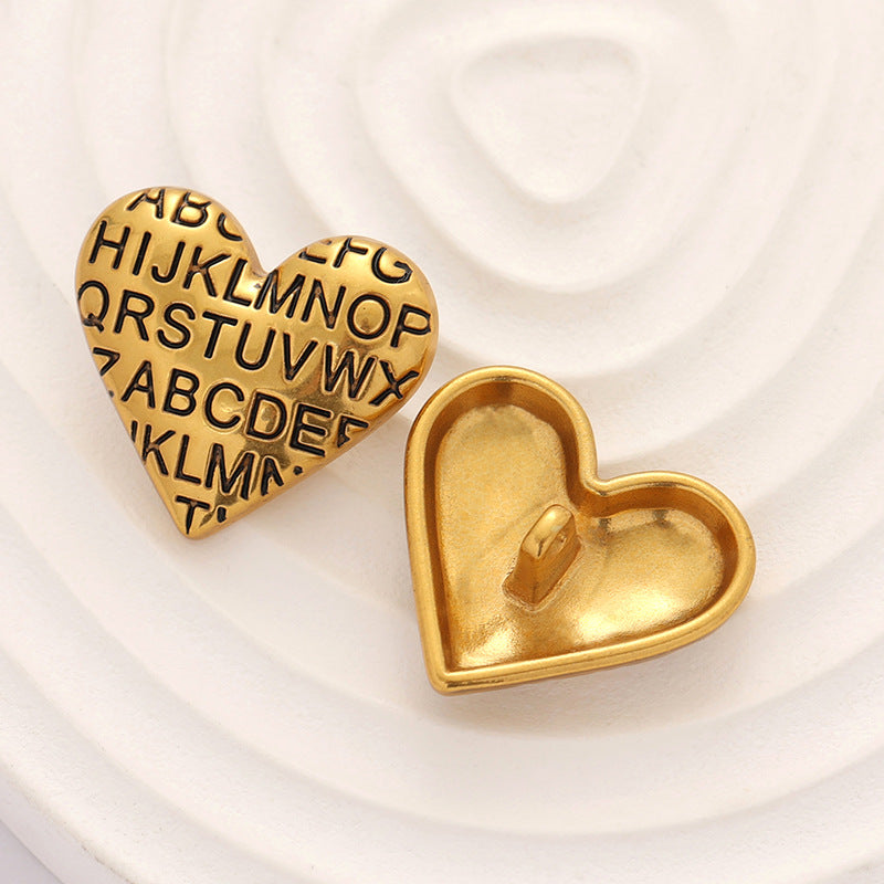 Pair of gold heart-shaped vintage letter metal buttons with alphabet engraving