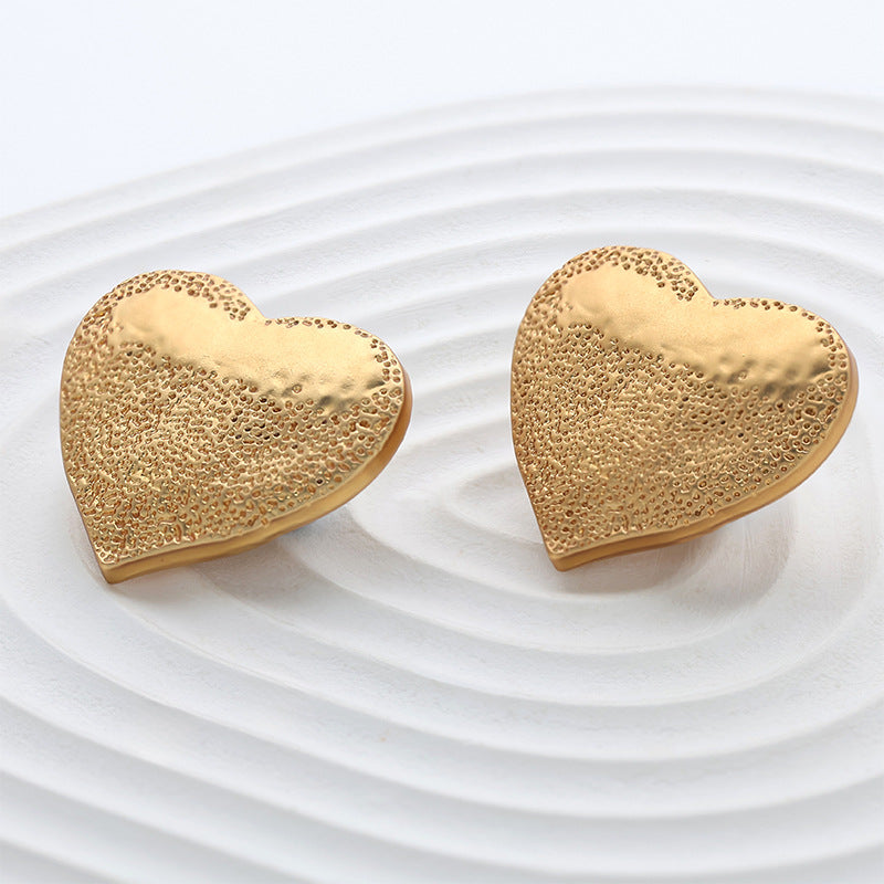 Pair of 25mm gold heart metal sewing buttons, speckled dotted pattern