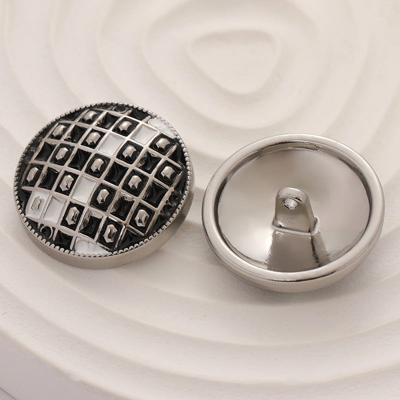 Black-and-white checkerboard epoxy metal button with loop and shank back