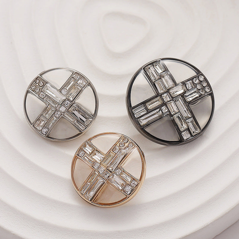 3 round transparent diamond cross metal buttons: silver, black, and gold tones