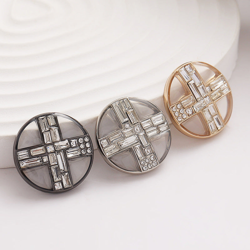Round transparent diamond cross metal buttons set in black, silver, and gold tones