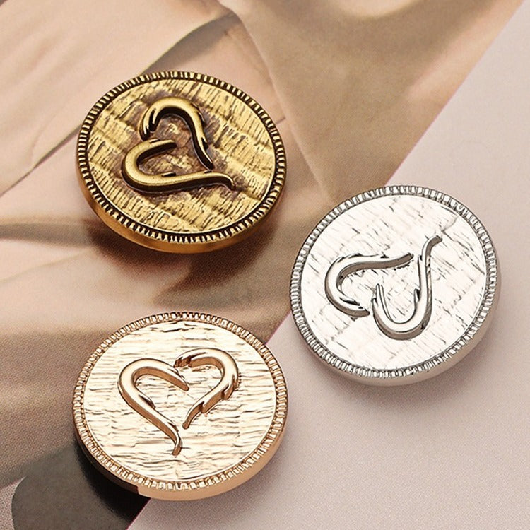 Metal decorative button, antique gold finish, heart carved design