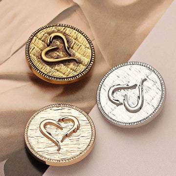 Metal decorative button, antique gold finish, heart carved design