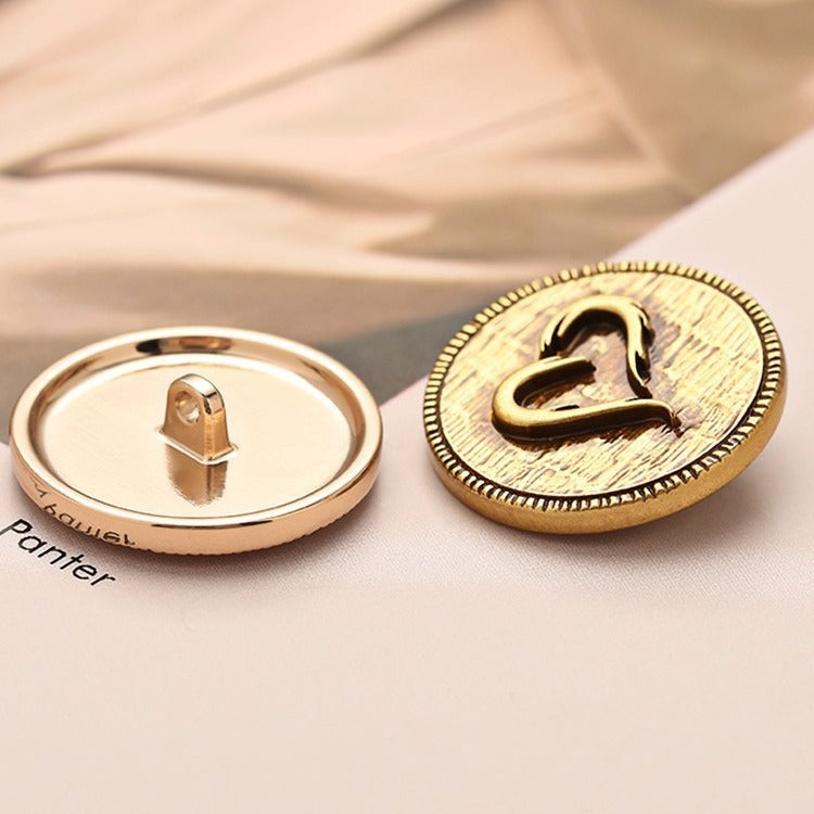 Shank-back metal heart button, light gold tone with engraved heart