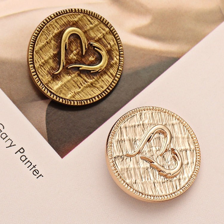 Metal decorative button, silver-white finish, heart carved motif with border