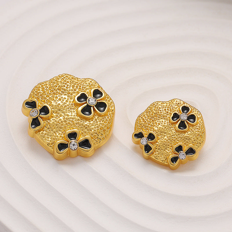 Goldfarbene Metallknöpfe mit vier Schmetterblumen und Strass-Steinen, rund