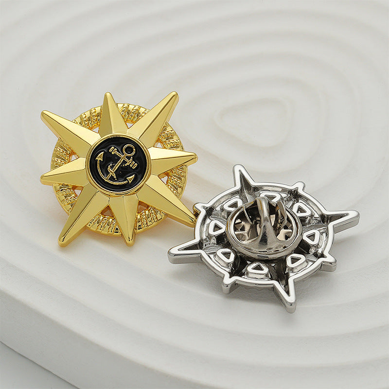 Two-pack anchor emblem star brooches: gold star and silver star with black center