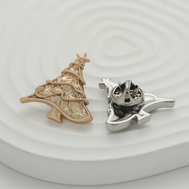 Gold and silver Christmas tree metal pin brooches with pin backs visible