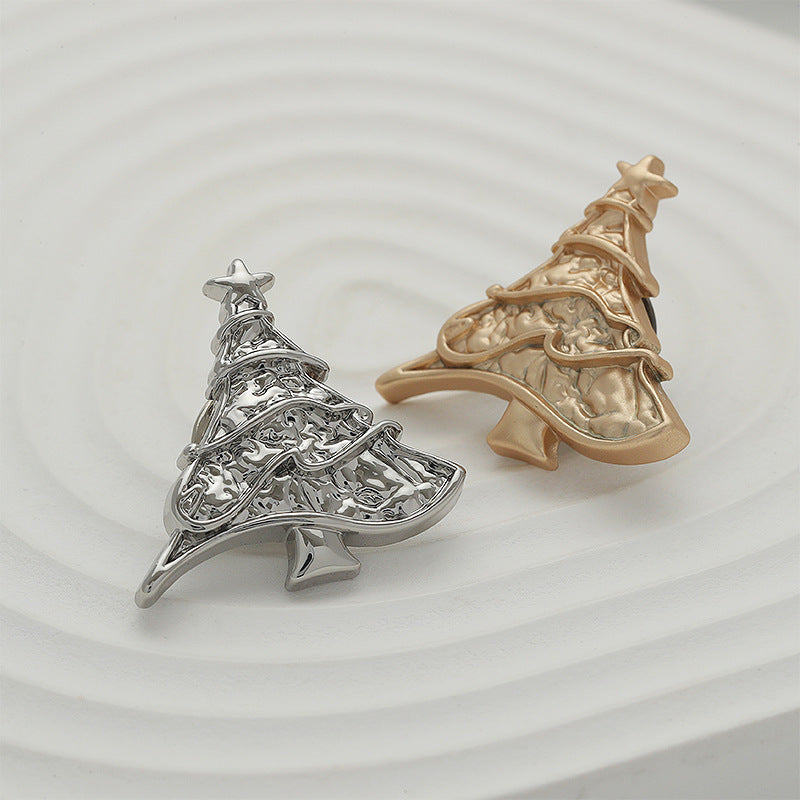 Silver and gold Christmas tree shaped metal pin brooches with layered detailing