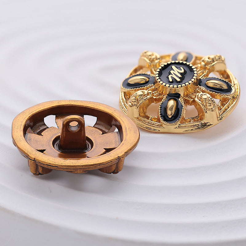 Gold hollow metal button back with four-prong shank