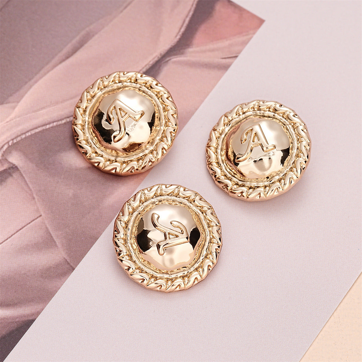 23mm light gold round sewing button with letter A and textured rim (10-pack)