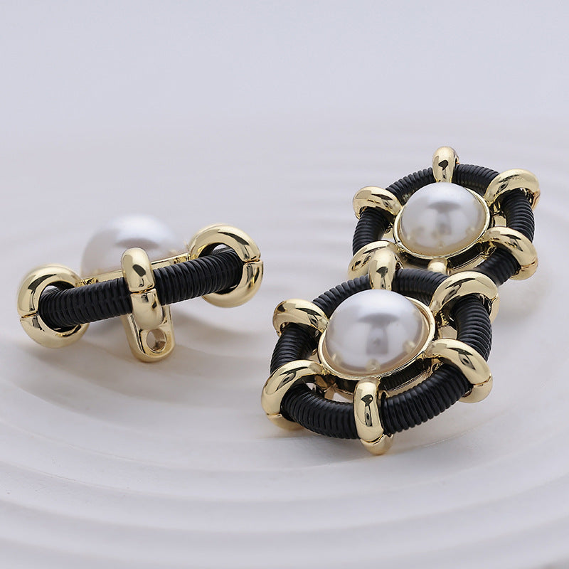 Hollow pearl metal sewing buttons with black ribbed ring and round pearl-effect centers