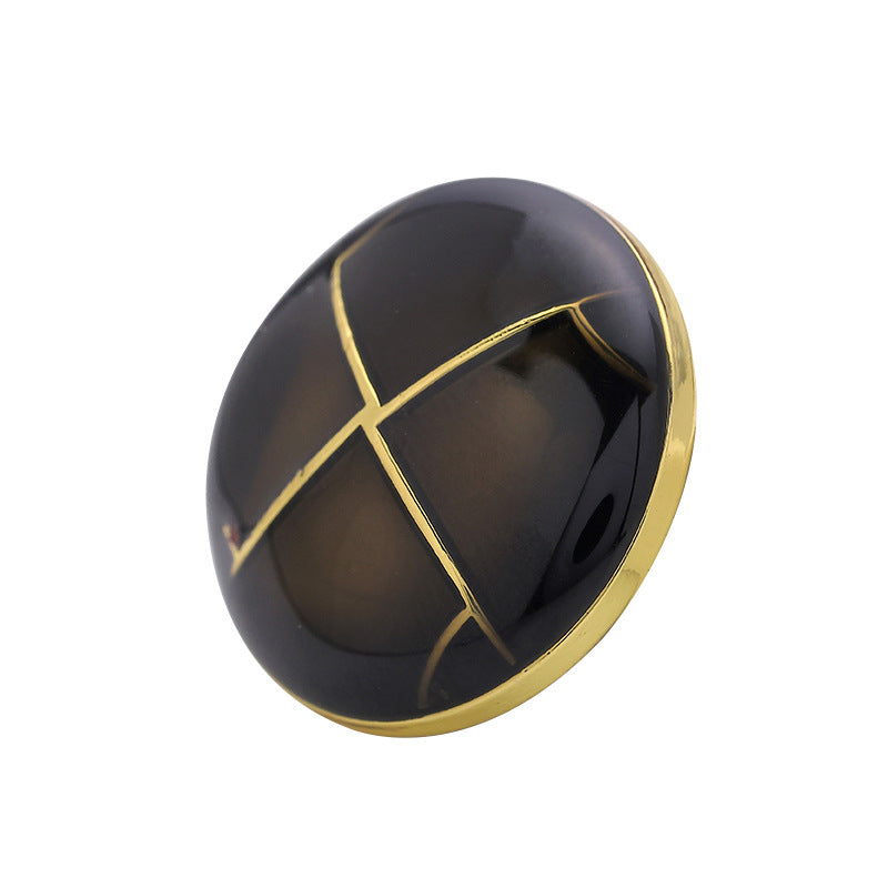 23mm black crosshatch metal button with gold border, front view