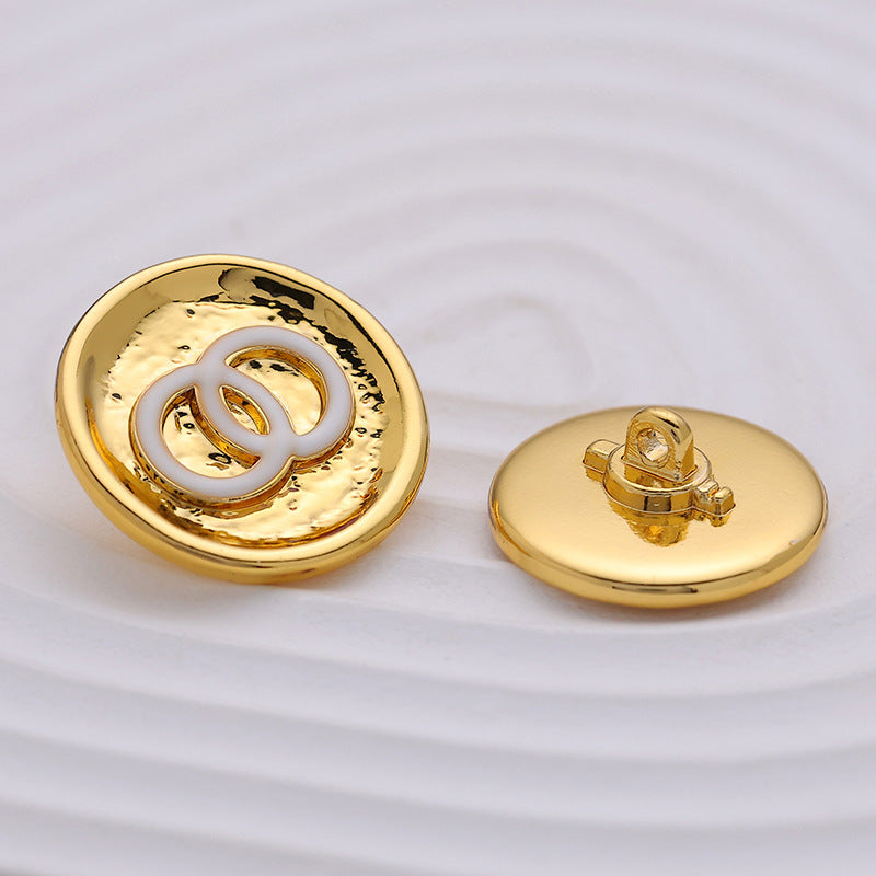 White gold metal button, double-circle front with white enamel and visible metal shank