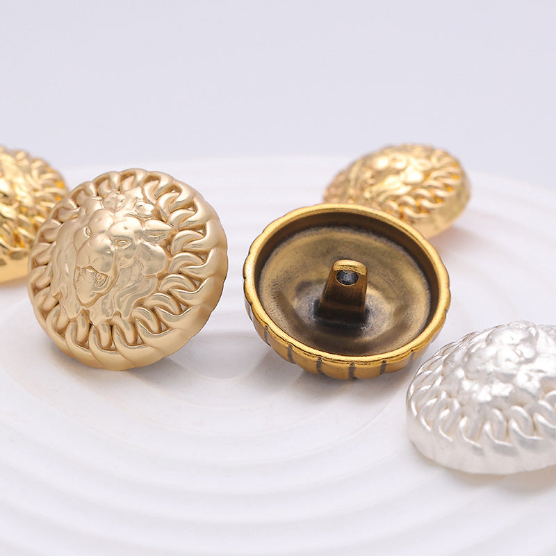 Round metal button back view with shank, lion head, gold-tone