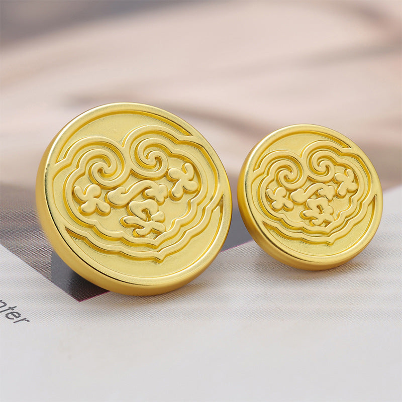 Pair of gold-tone Chinese-style metal buttons with embossed cloud motif