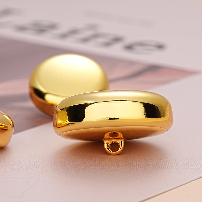 Gold hollow decorative button reverse, two loops and center hole for sewing
