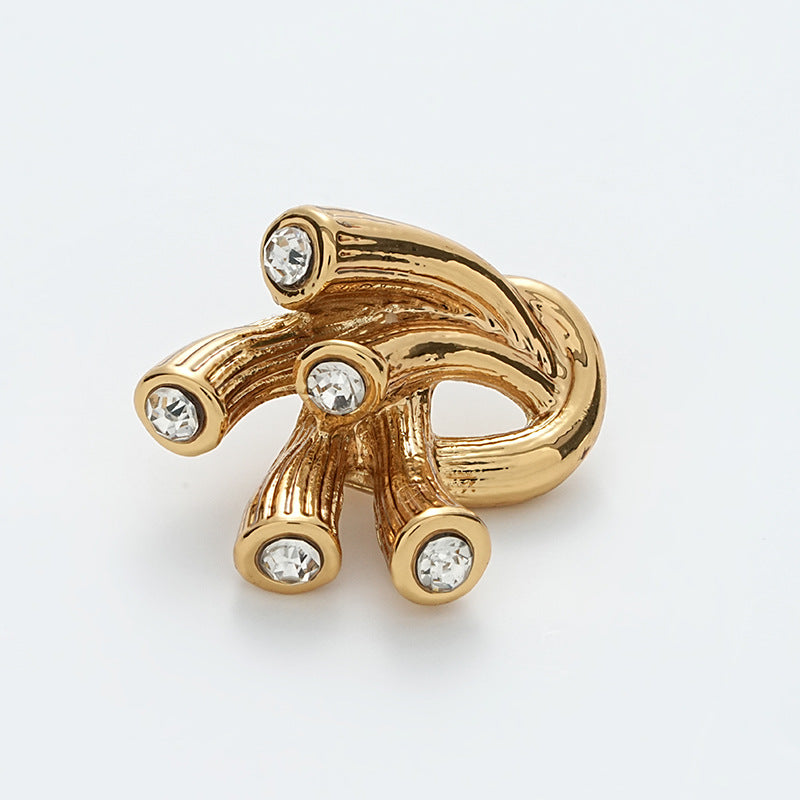 Gold metal antennae button with irregular shape and 5 rhinestone gems