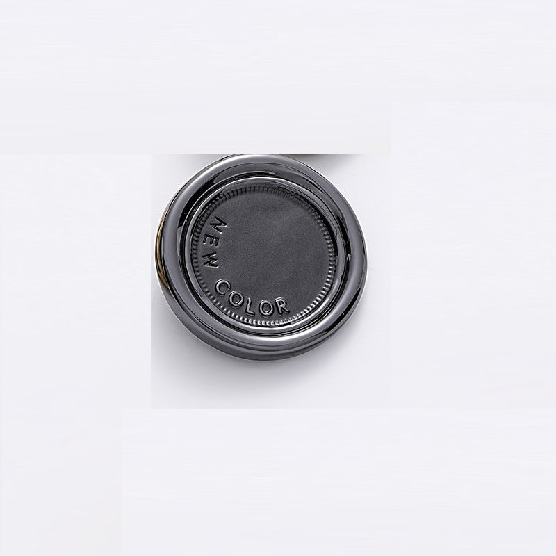 Gray-black two-tone round metal sewing button, dark center, reverse side embossed COLOR.