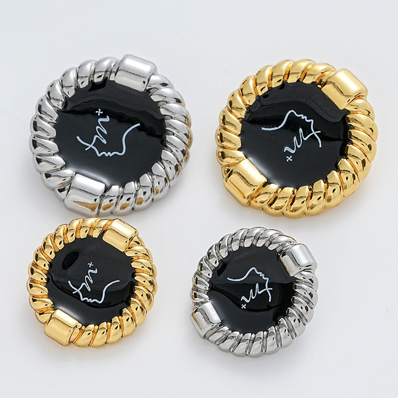 Set of metal buttons with black glossy faces: gold and silver rope-edge designs