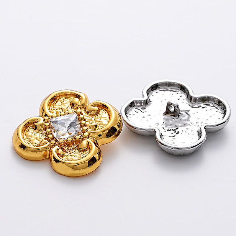 Flower-shaped metal blouse buttons, gold and silver tones with clear faceted centers