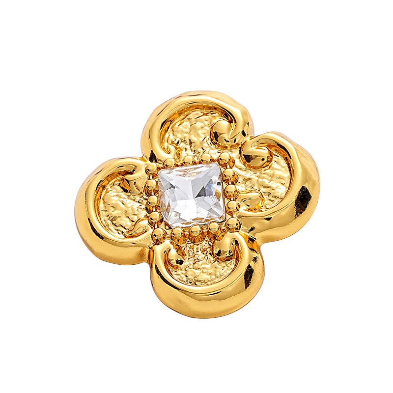 Gold flower-shaped diamond blouse button with central clear faceted crystal