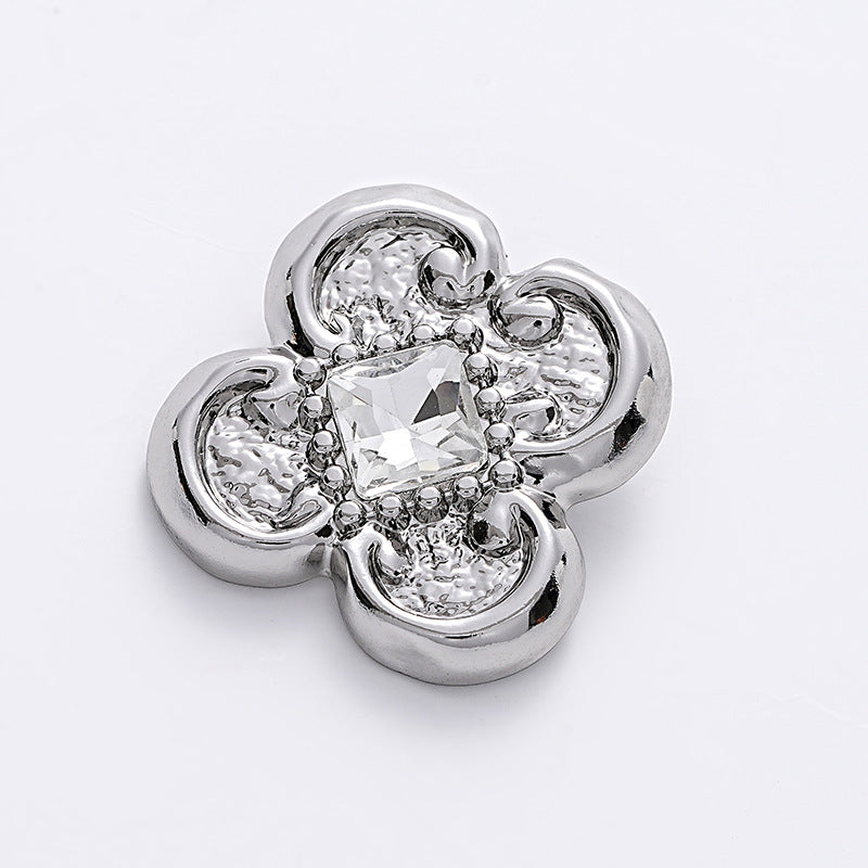 Silver flower-shaped diamond blouse button with central clear faceted crystal