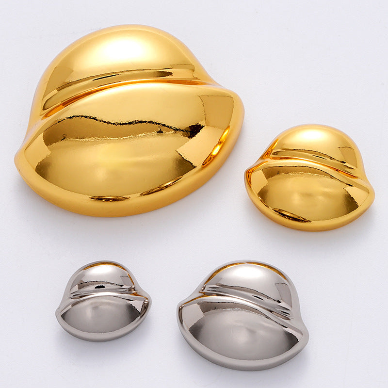 Golden and silver clam-shell metal buttons showing front domes and smaller backs