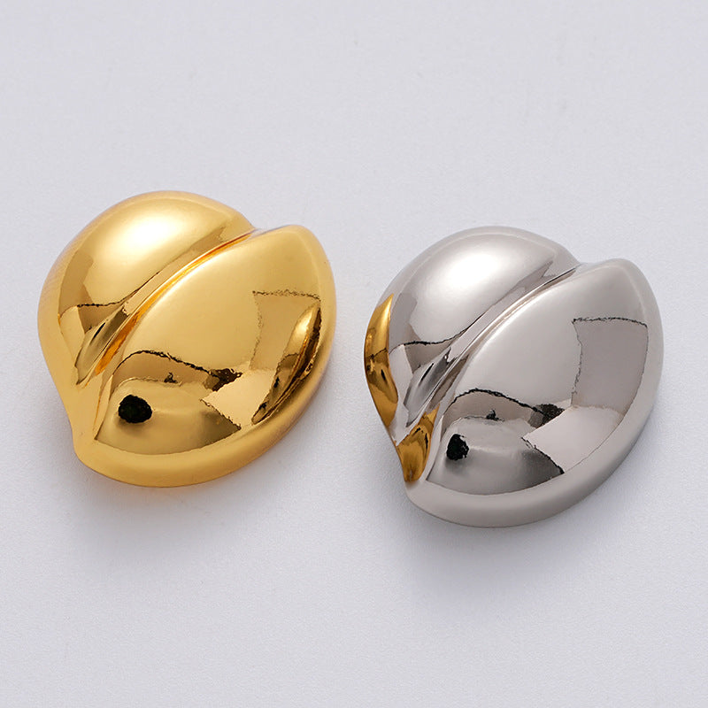 Golden clam-shell metal button with glossy irregular shell shape