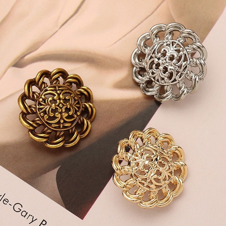Hollow floral metal button in gold, bronze and silver finishes with filigree cutouts