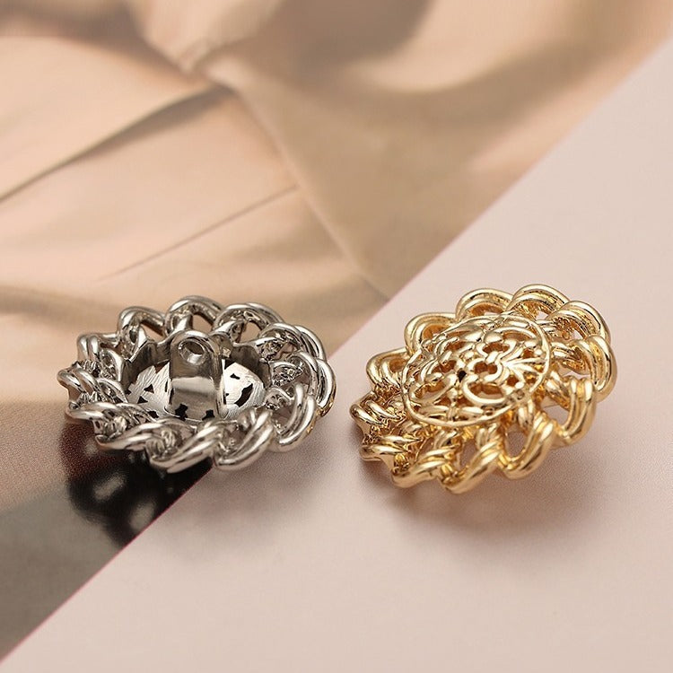 Silver and gold hollow floral metal buttons with ornate filigree cutout design