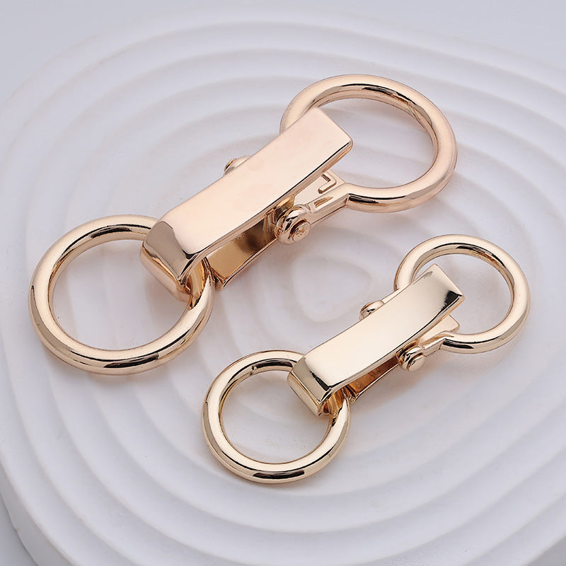Metall-Gürtelverschluss, goldfarben, zwei Ringösen mit Arretierungsmechanismus