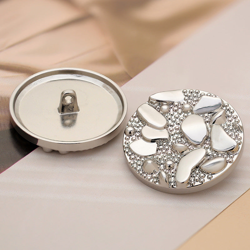 Back and front of 30mm silver metal coat button with pebble road pattern
