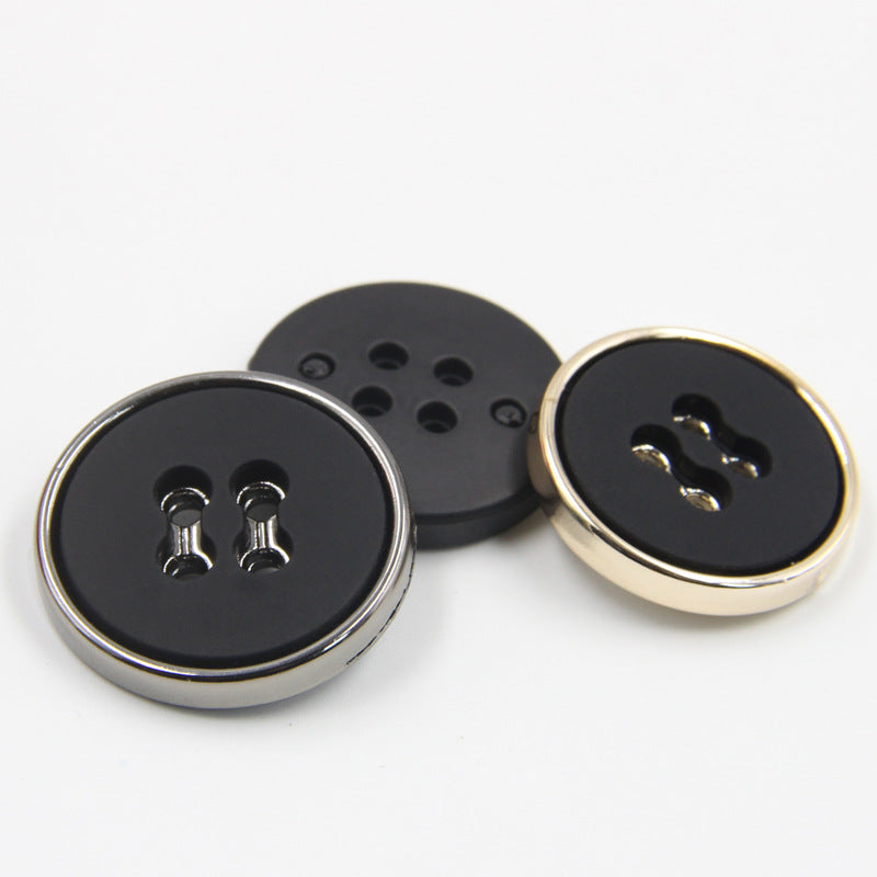 Black round plastic button set, four-hole design with silver and gold-tone edges