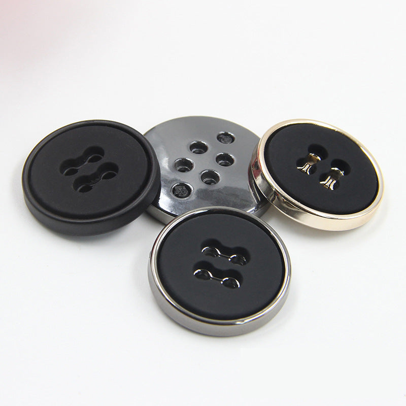 Round plastic buttons with four-hole design: black fronts with silver and gold-tone edges