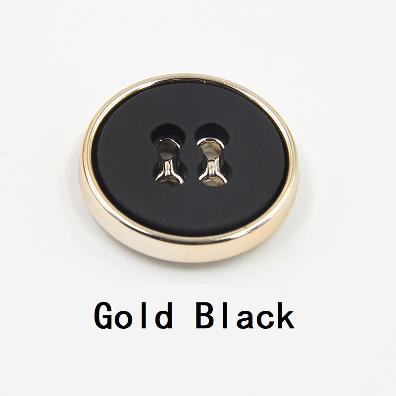 Gold black round plastic button with four-hole design and gold-tone edge