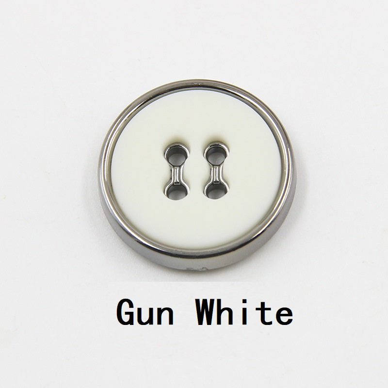Gun white round plastic button with four-hole design and gunmetal edge