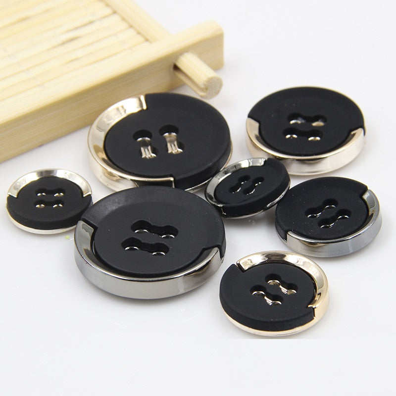 Black gold-trimmed sew-on buttons with 4 holes and decorative cutout backs, 15–30mm.