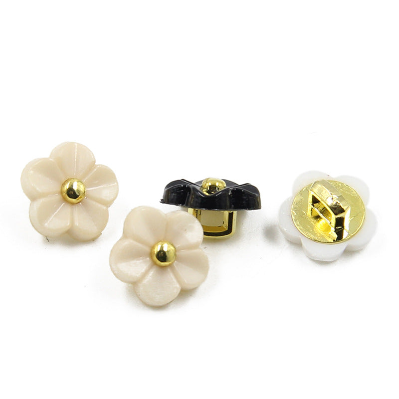 11mm flower resin shirt buttons with gold shank; cream, black, and white buttons shown