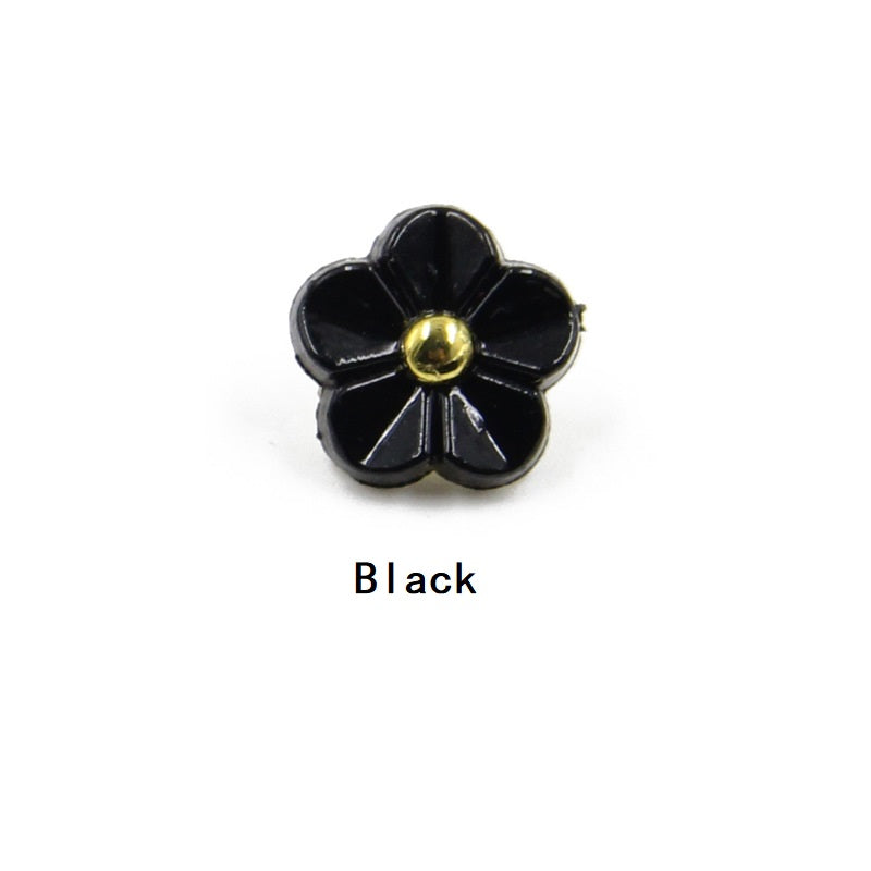 Black 11mm flower resin shirt button with gold shank center