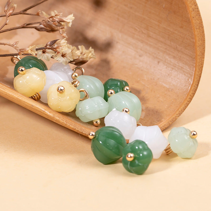 Mixed set of pumpkin-shaped glazed cheongsam buttons in cream, light green, and green, gold shanks