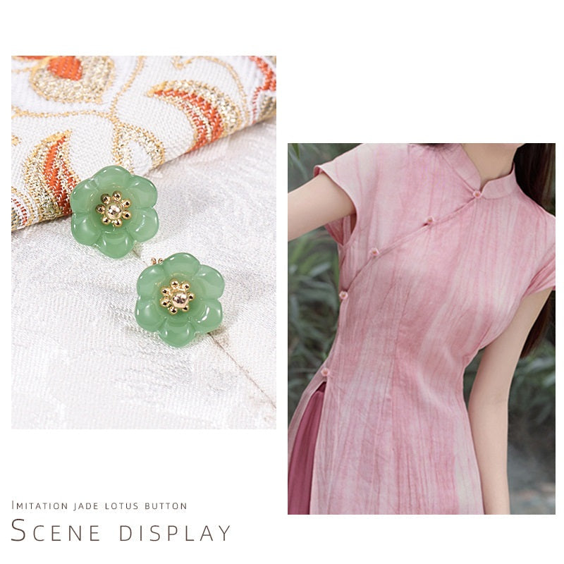 Green lily-of-the-valley glaze buttons with gold-tone floral centers and top loop shanks.