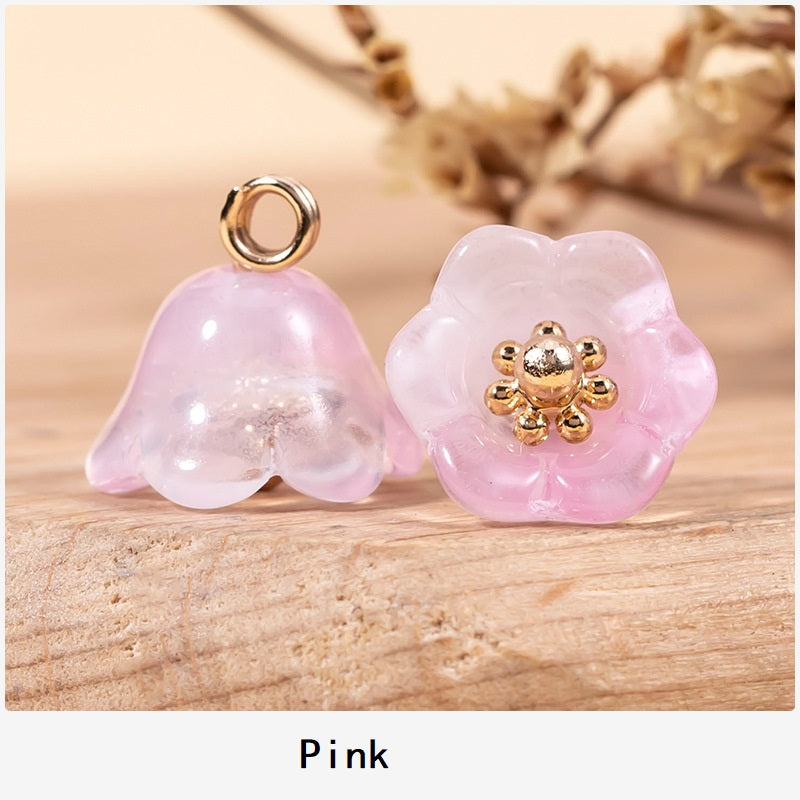 Chinese glaze lily of the valley button, pink with gold-tone flower center and loop